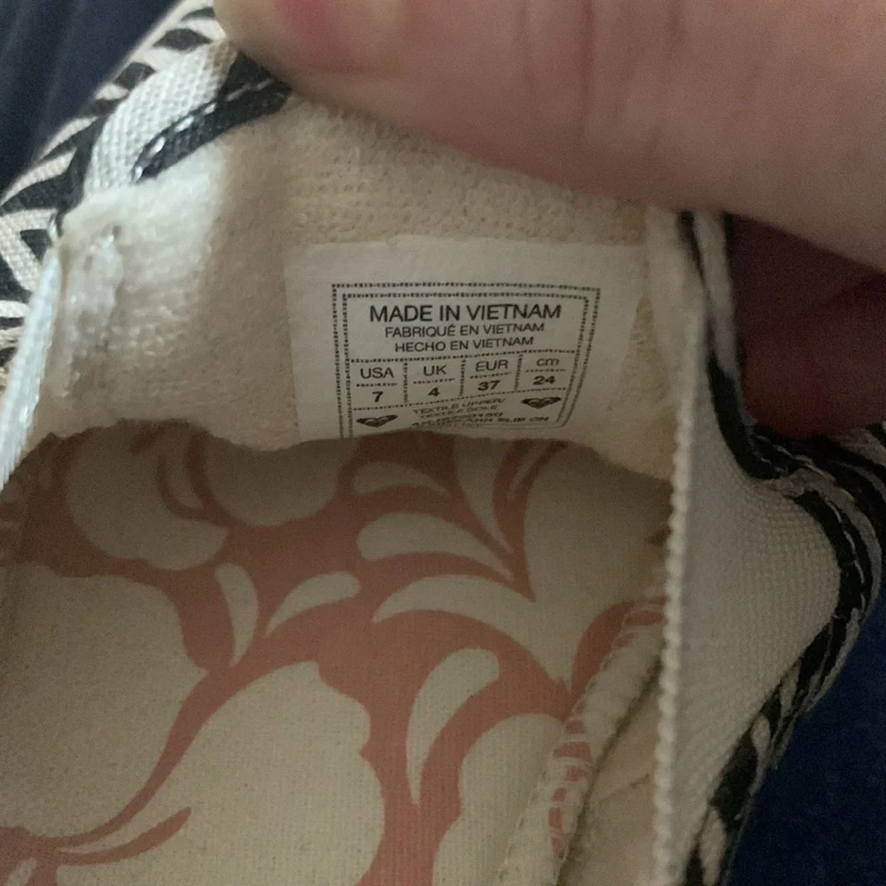 Roxy Zebra Print Platform Slip-On Sneakers in Black and Cream